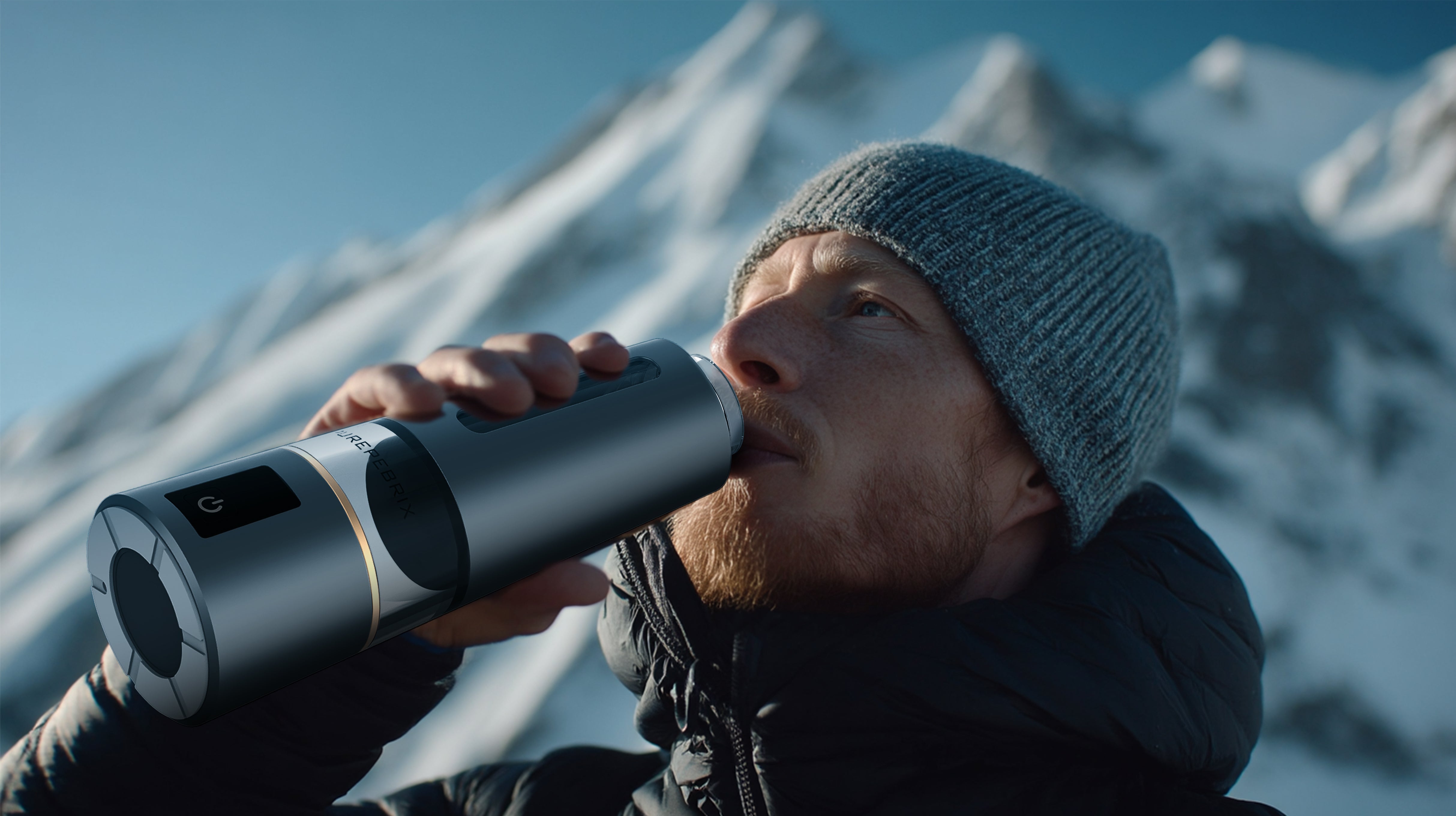 Person drinking from PUREPEBRIX Hydrogen water bottle with snowy mountains in the background